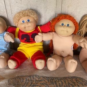 Four cabbage patch dolls
